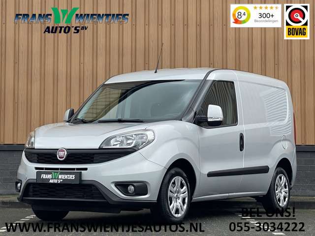 Fiat Doblò 1.3 MJ L1 | Marge! | Trekhaak | Navigatie | Airconditioning | Cruise Control | Bluetooth | DAB | Multifunctioneel Stuurwiel | Elektrische Spiegels | Elektrische Ramen |